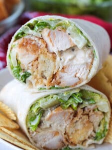 chicken caesar wrap cut and stacked on a plate