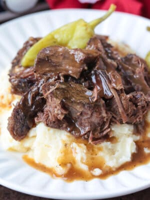 pot roast with peppers on bed of mashed potatoes