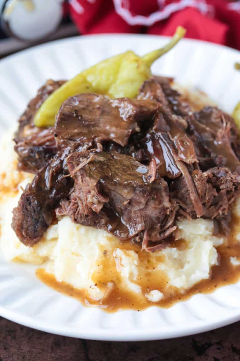 pot roast with peppers on bed of mashed potatoes