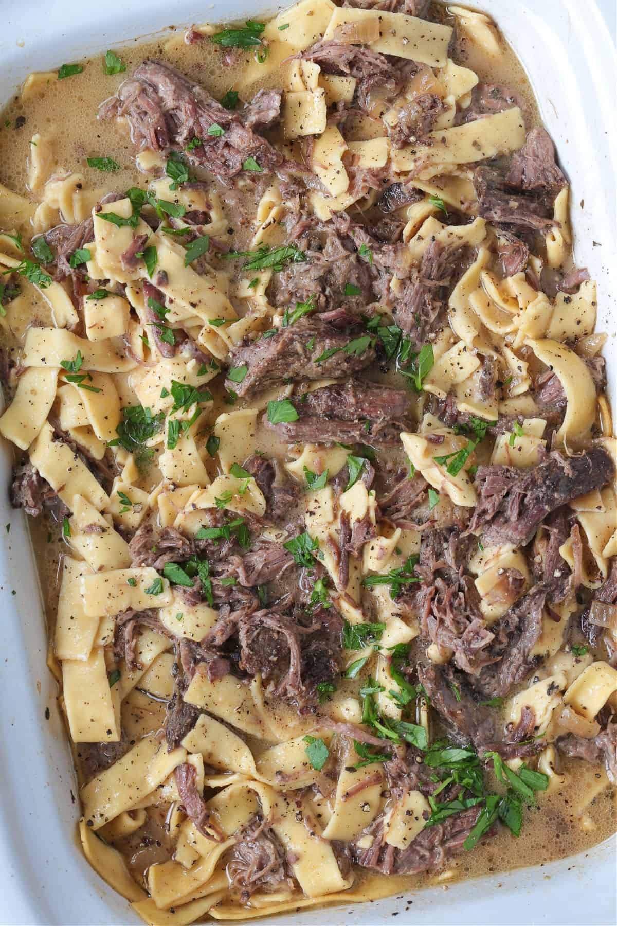 slow cooker with shredded beef and noodles