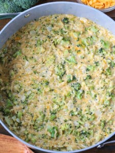 cheesy broccoli orzo in a pot from the top view