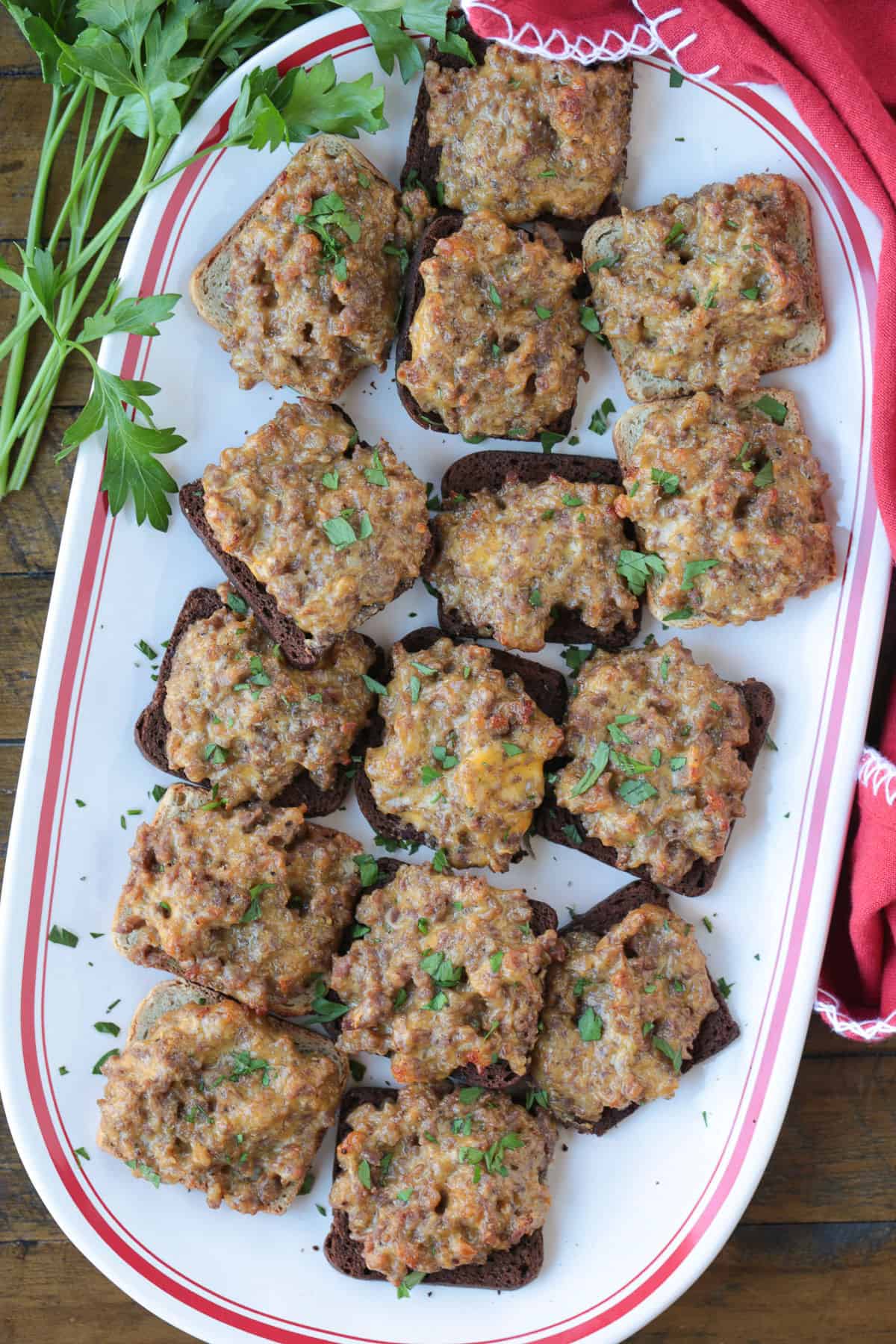 platter of ground beef, sausage and Velveeta appetizers on cocktail rye