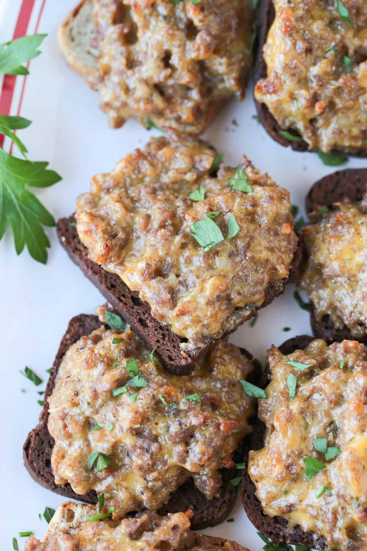 close up of ground beef and velveeta appetizers on cocktail rye