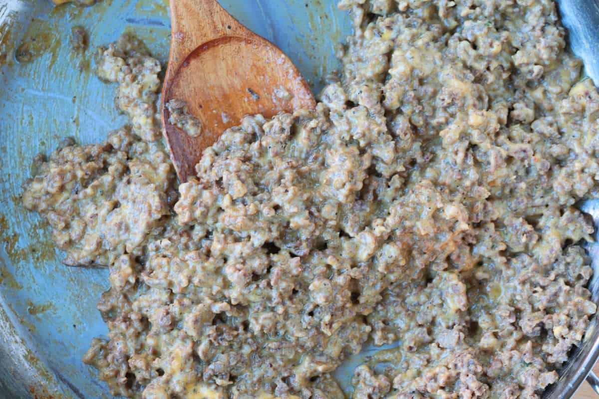 ground beef, sausage and melted Velveeta in a skillet