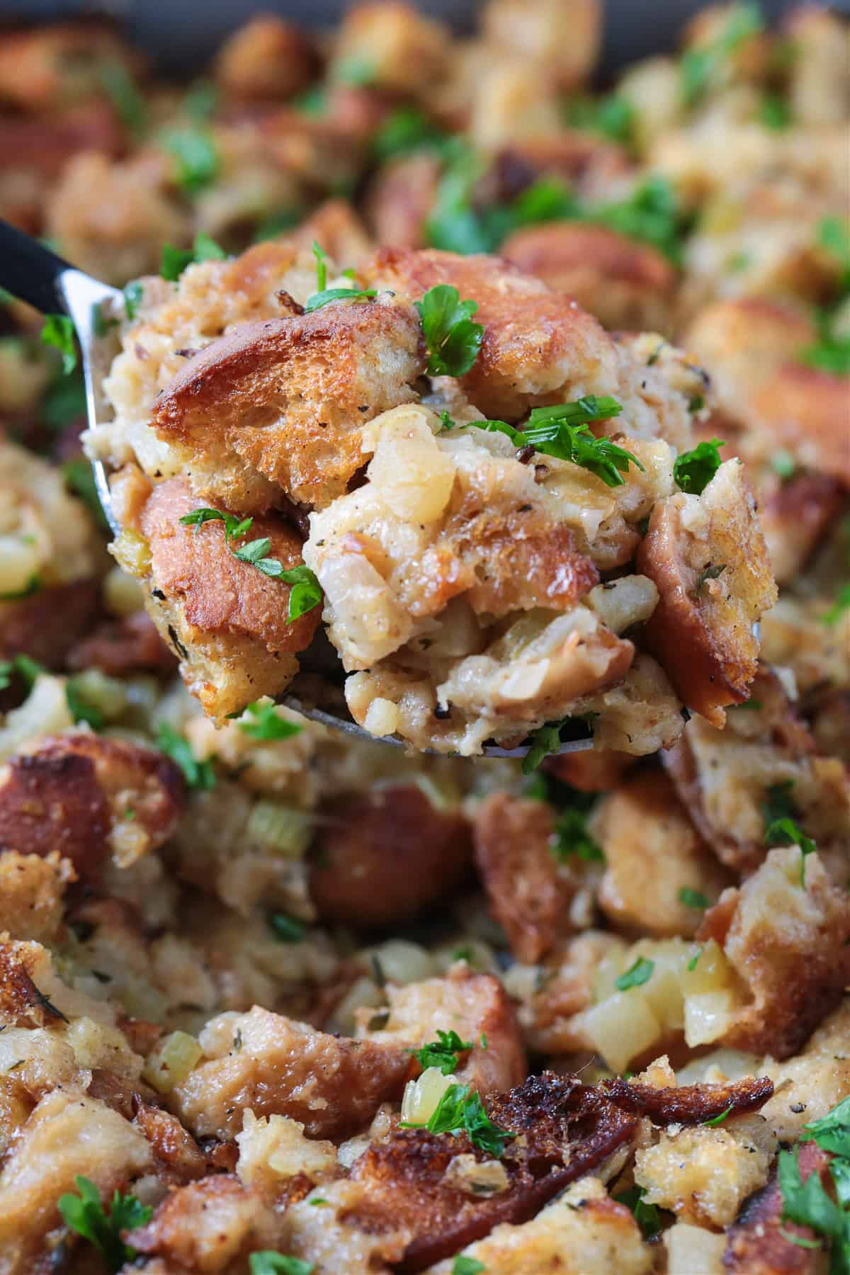 sourdough stuffing on a serving spoon