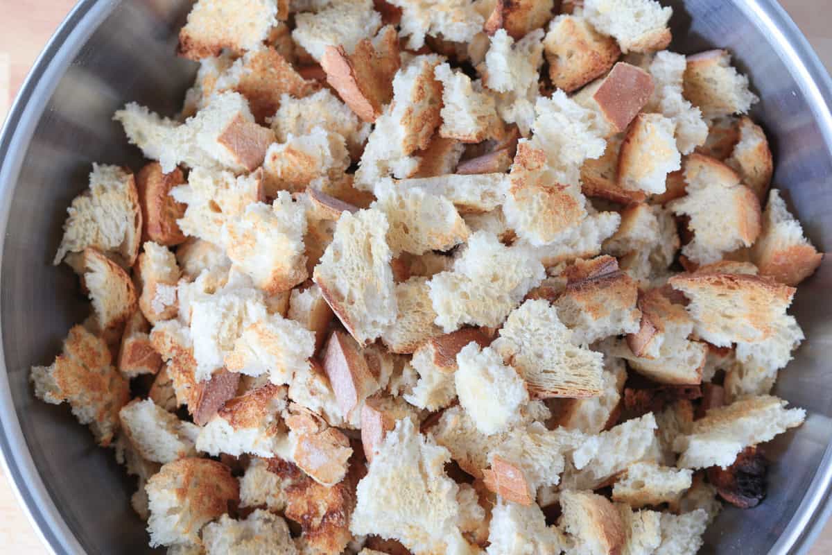 torn sourdough bread in a bowl for making stuffing
