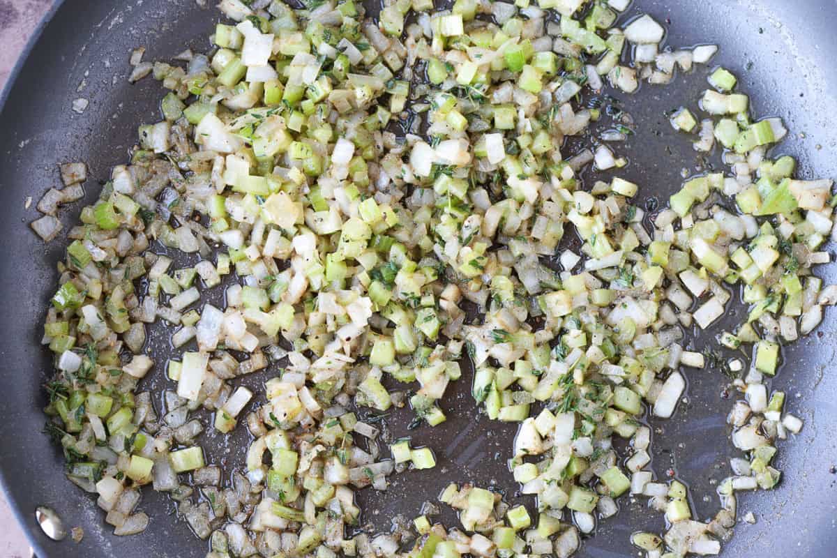 diced celery and onions in a skillet