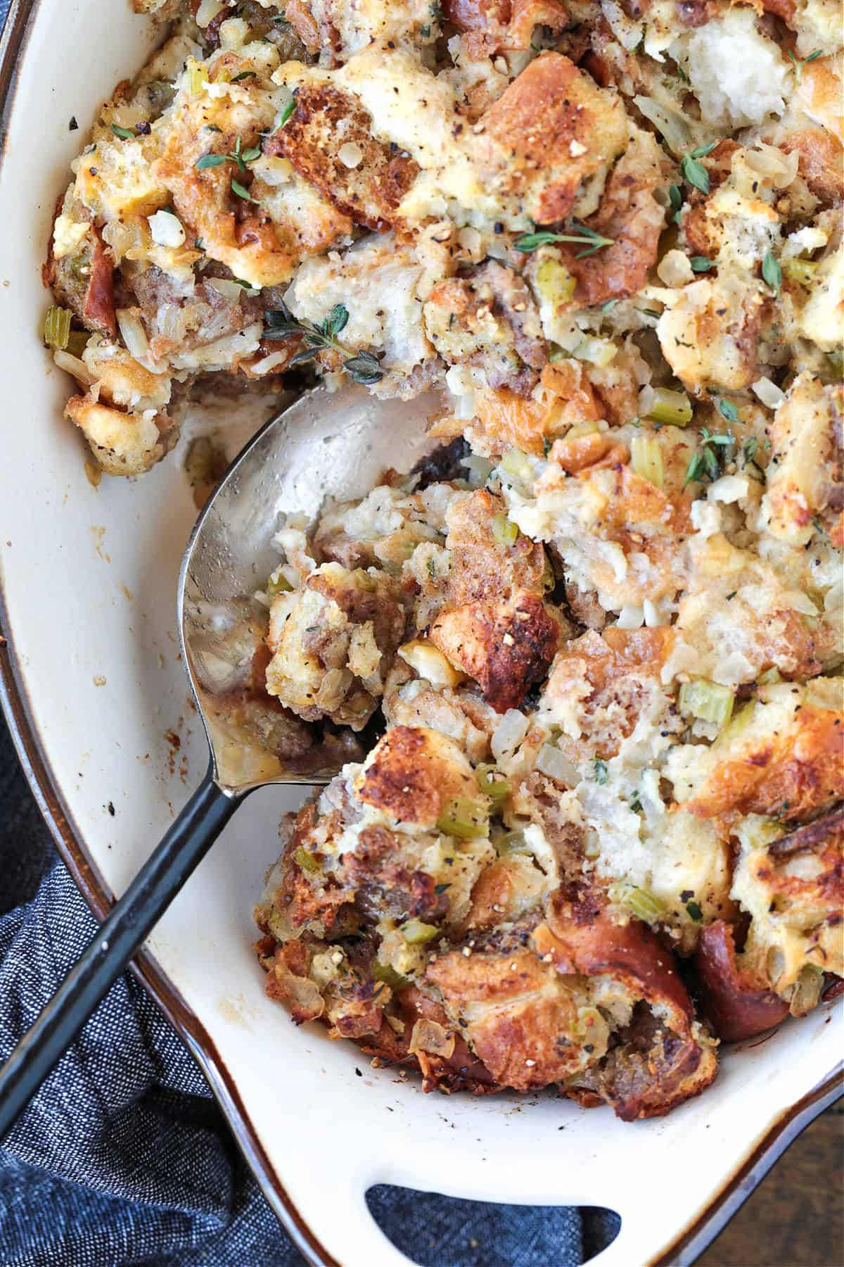 stuffing in a baking dish with spoon