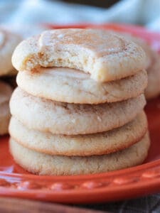 iced sugar cookies stacked on a plate
