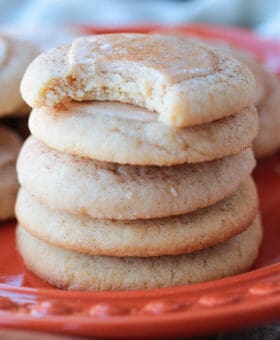 iced sugar cookies stacked on a plate