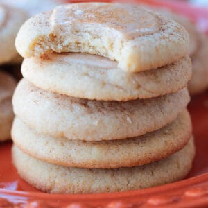iced sugar cookies stacked on a plate