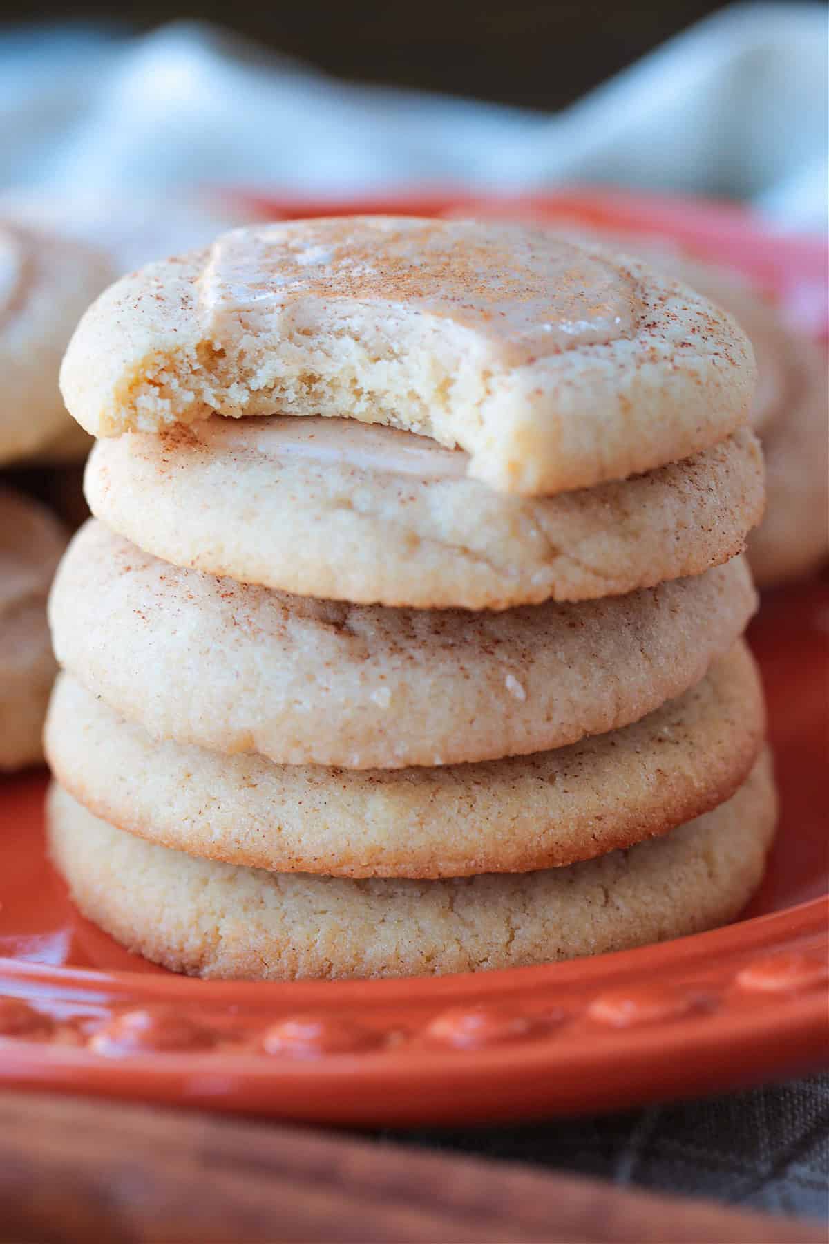 iced sugar cookies stacked on a plate