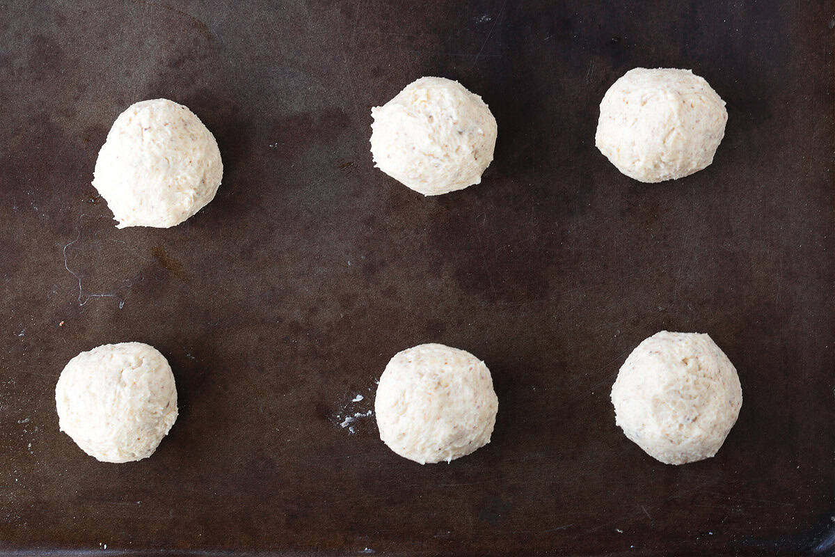 balls of cookie dough on baking sheet