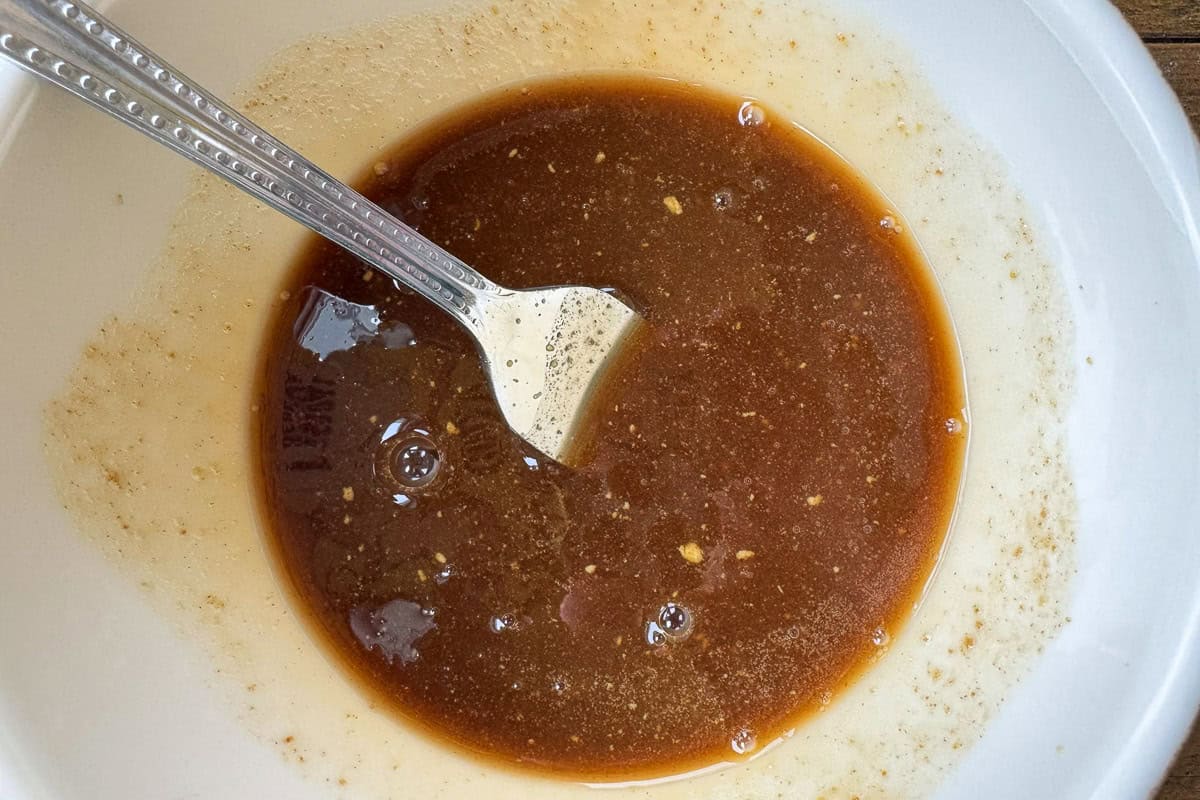 brown sugar and mustard glaze in a bowl with a fork