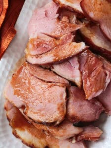 close up of sliced ham with glaze on a platter