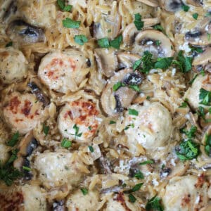 skillet with mushroom orzo and chicken meatballs