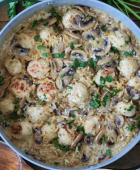 skillet with mushroom orzo and chicken meatballs