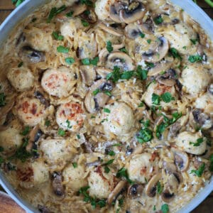 skillet with mushroom orzo and chicken meatballs