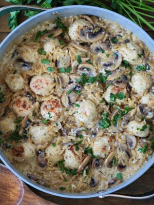 skillet with mushroom orzo and chicken meatballs