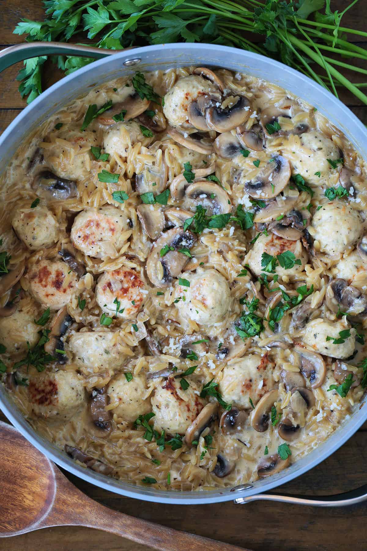 skillet with mushroom orzo and chicken meatballs
