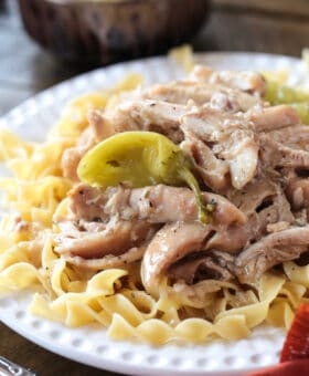 mississippi chicken over egg noodles with pepperoncini peppers