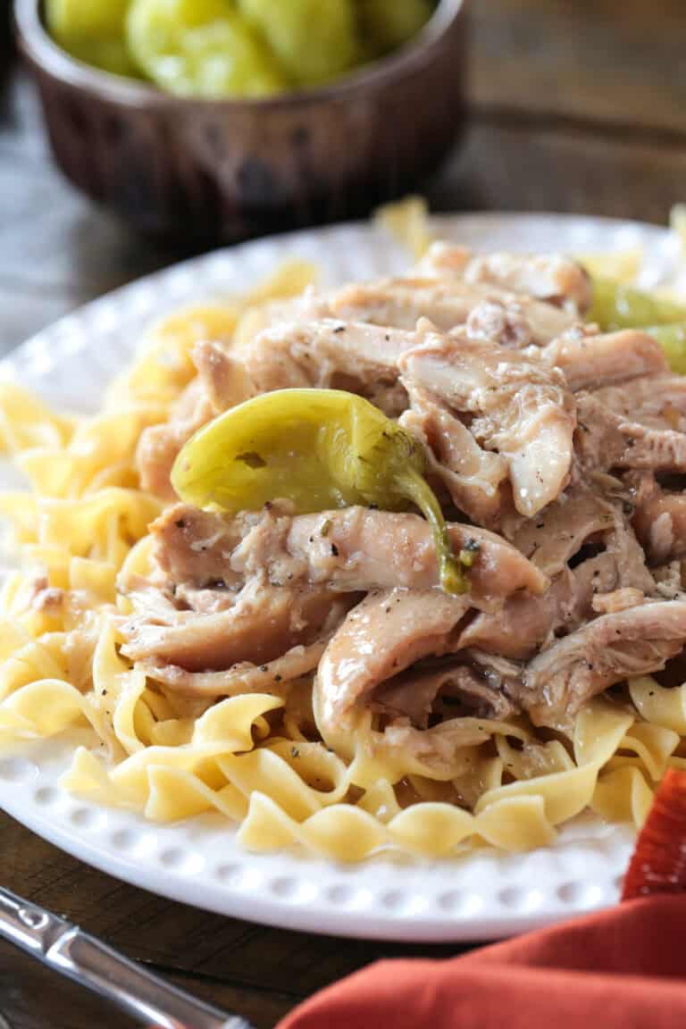 mississippi chicken over egg noodles with pepperoncini peppers