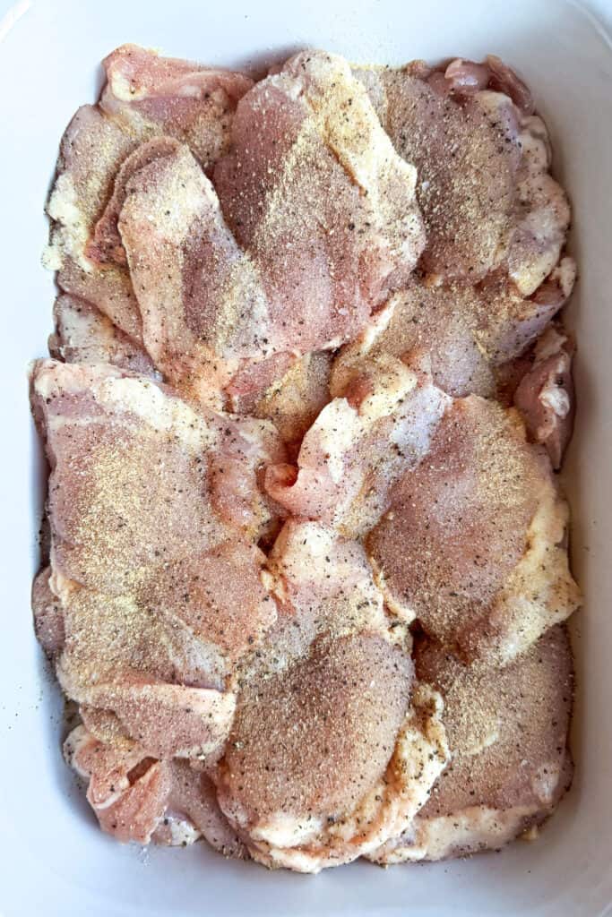 Mississippi Chicken is an easy, 5 ingredient dinner! Tender chicken in a tangy and zesty gravy spooned over mashed potatoes or noodles! chicken in a slow cooker with seasonings