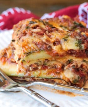 slice of zucchini lasagna on a plate with fork