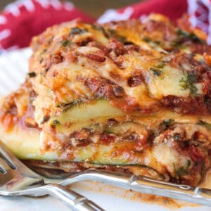 slice of zucchini lasagna on a plate with fork