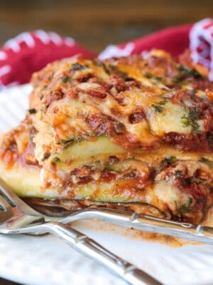 slice of zucchini lasagna on a plate with fork