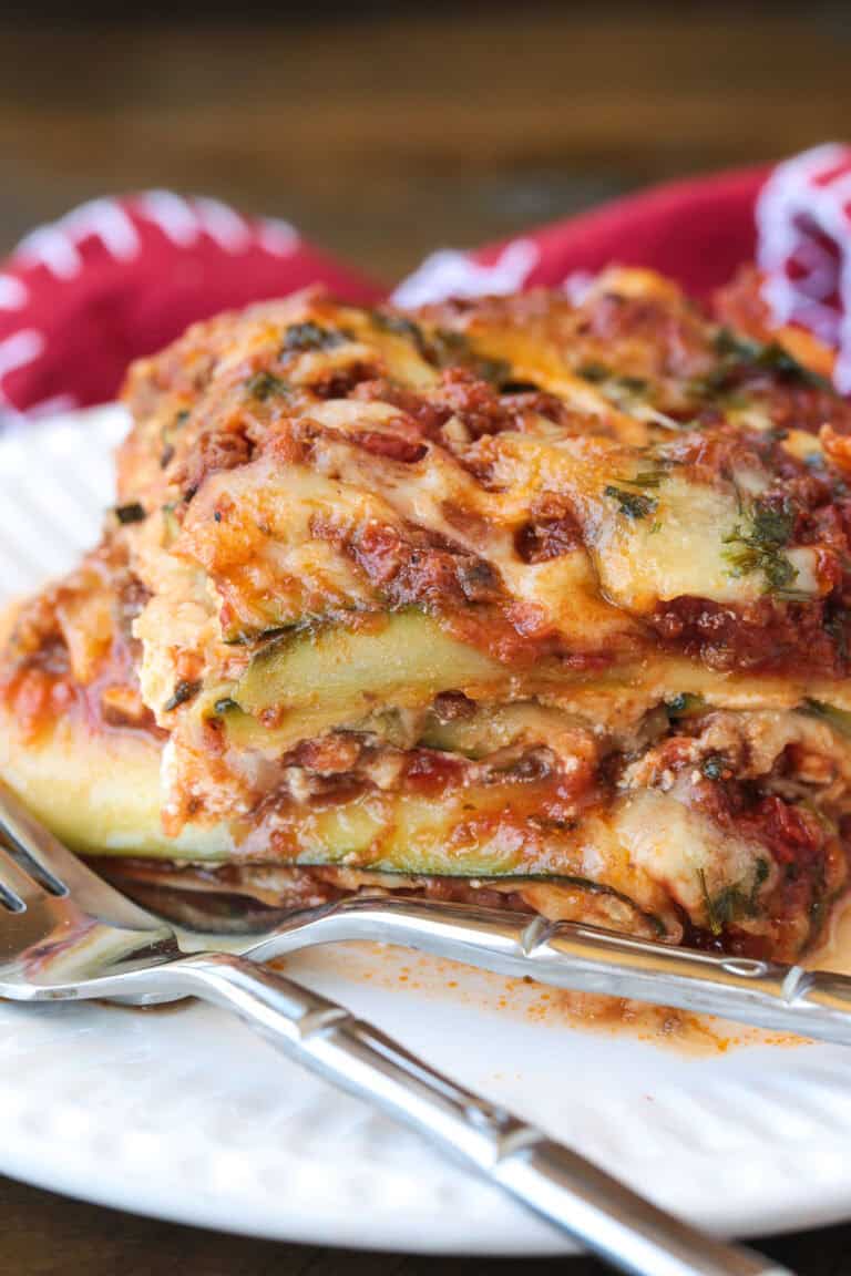 slice of zucchini lasagna on a plate with fork