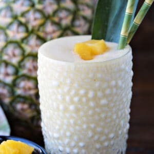 pineapple smoothie with pineapple in background