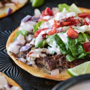 ground beef tortilla taco with sauce and toppings