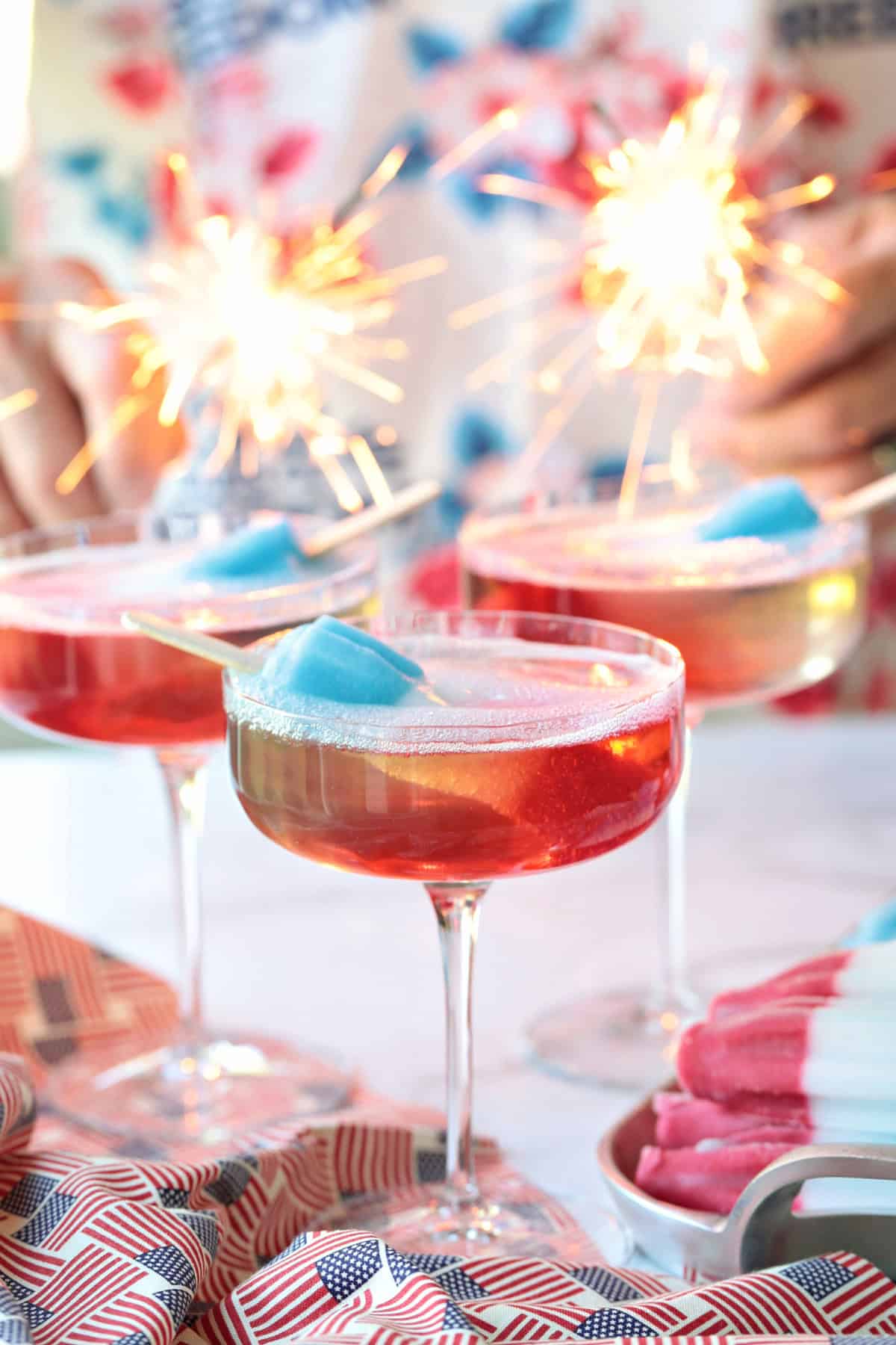 bomb pop cocktails with sparklers in the background