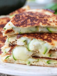 chicken quesadillas with sliced zucchini stacked on a plate