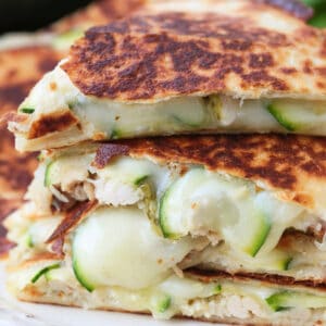 chicken quesadillas with sliced zucchini stacked on a plate
