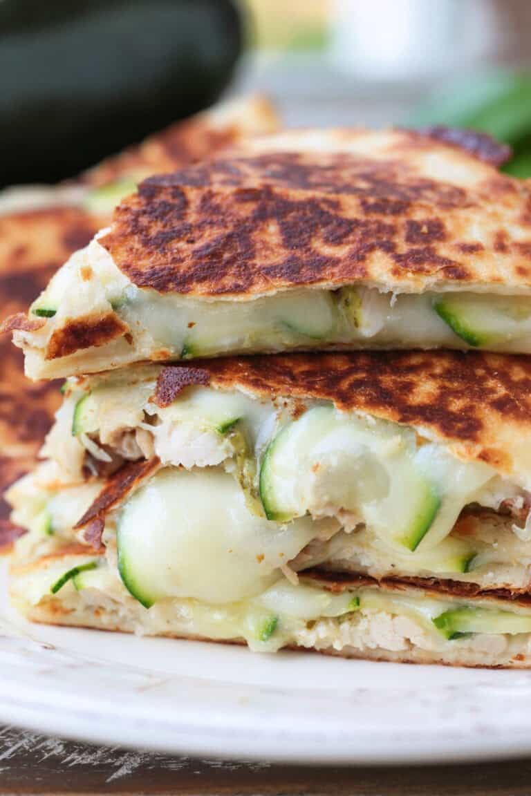 chicken quesadillas with sliced zucchini stacked on a plate