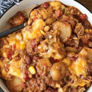 slow cooker cowboy casserole in bowl with text and title