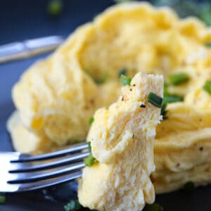 fork with a bite of microwave scrambled eggs
