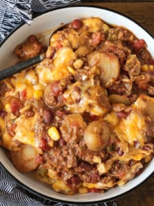 cowboy casserole in a round dish with napkin