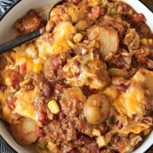 cowboy casserole in a round dish with napkin