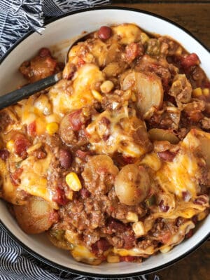 cowboy casserole in a round dish with napkin