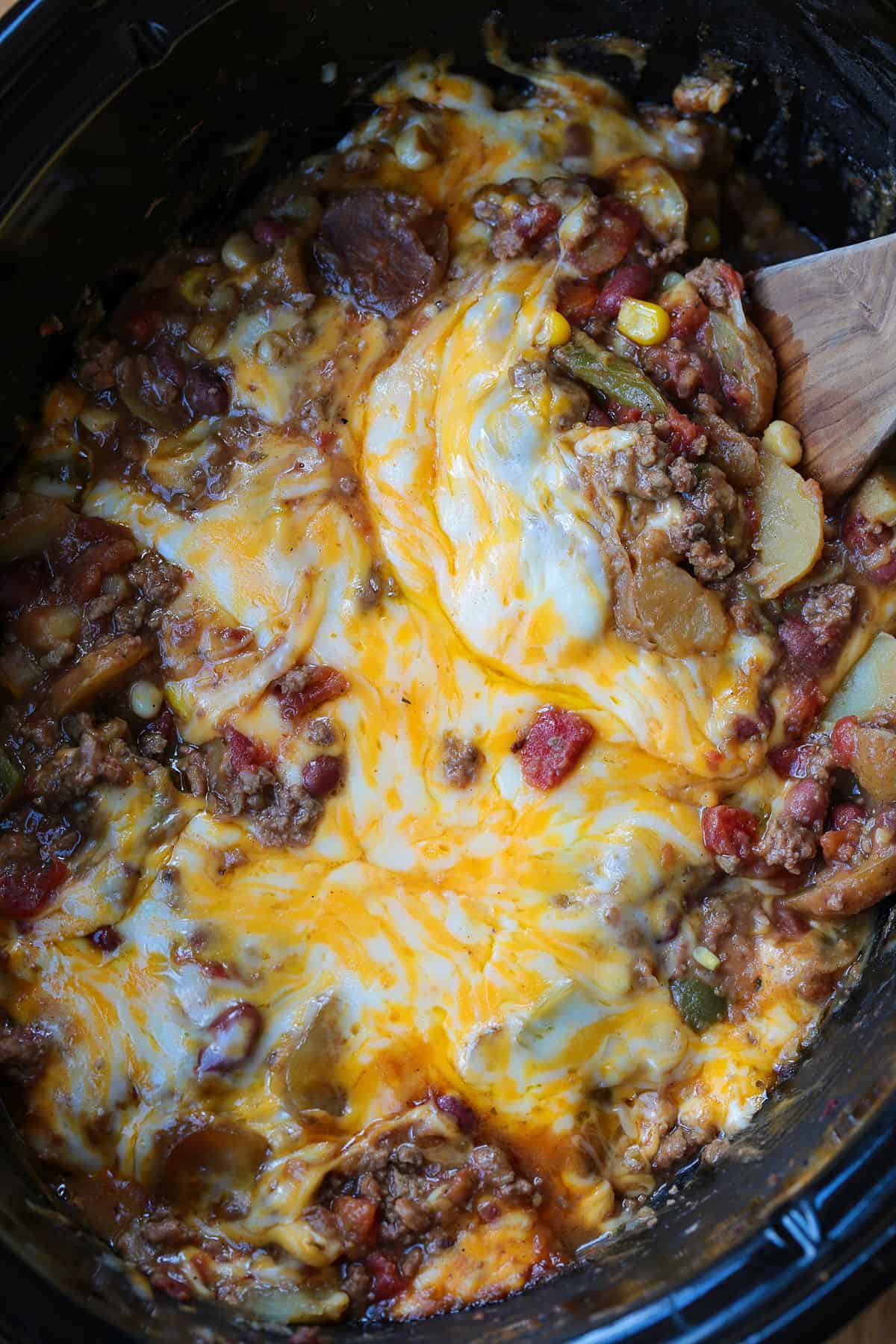 cowboy casserole in crock pot with spatula