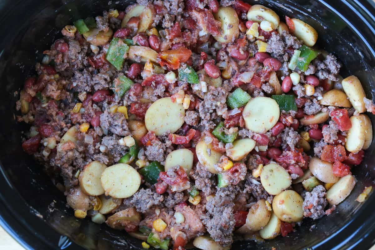 ground beef and vegetables in a crock pot