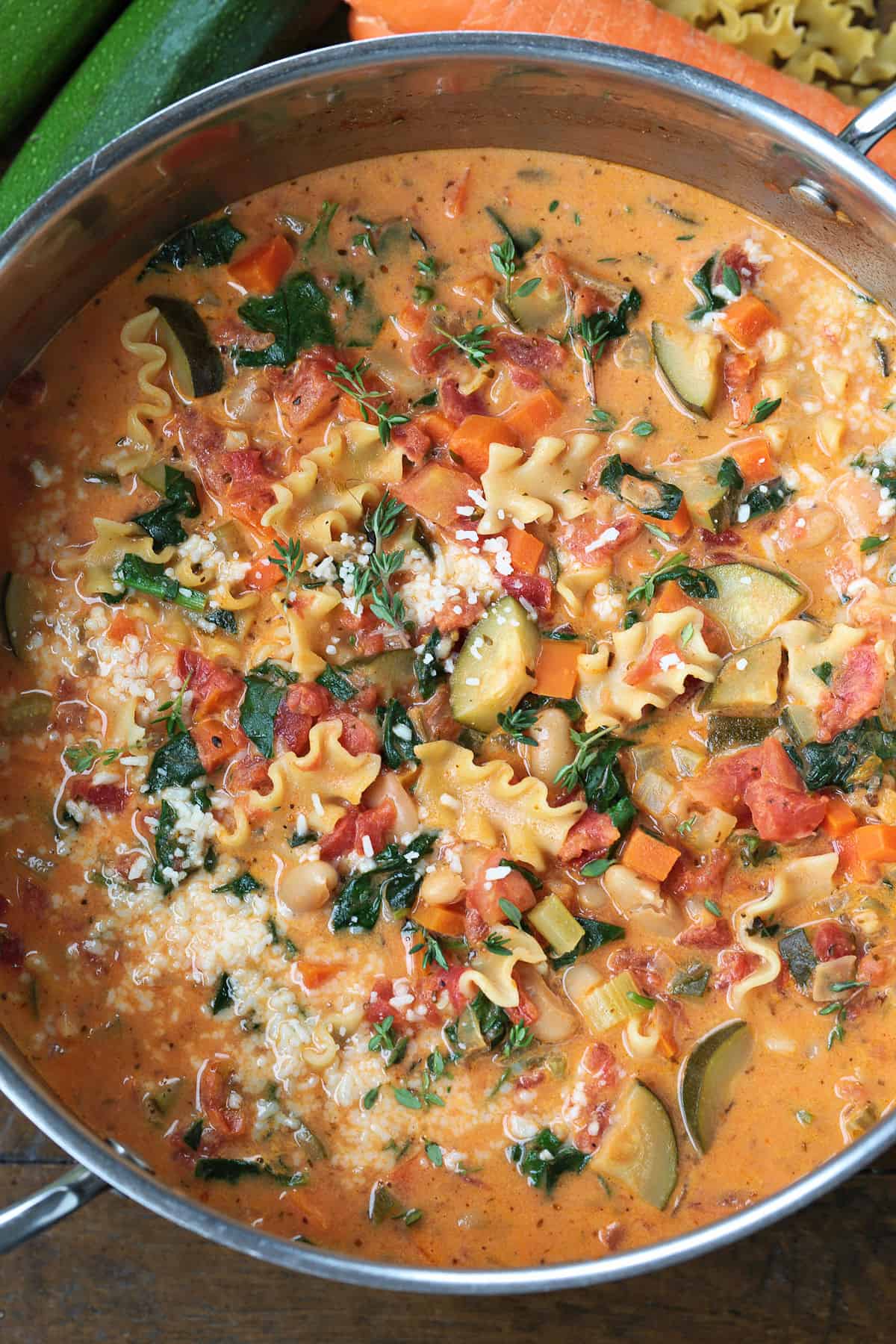 creamy minestrone soup with pasta in a pot from the top