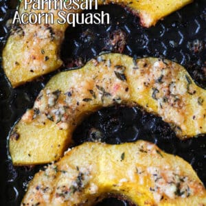 sliced and roasted acorn squash on a baking sheet